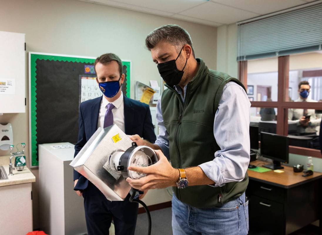 Matt Lisiewski, right, vice president at Norman S. Wright mechanical equipment, demonstrates ho ...