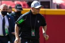 Las Vegas Raiders defensive line coach Rod Marinelli runs on the field before an NFL football g ...