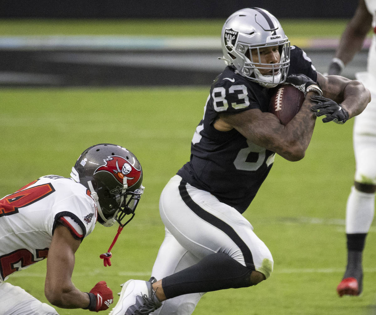 Las Vegas Raiders tight end Darren Waller (83) cuts up field past Tampa Bay Buccaneers cornerba ...