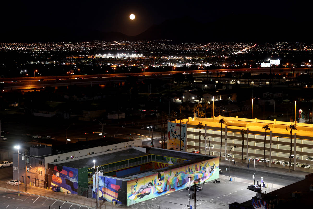 The Halloween Blue Moon rises over the Art Motel in downtown Las Vegas Saturday, Oct. 31, 2020. ...