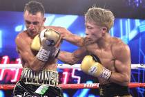 Naoya Inoue, right, connects with a punch against Jason Moloney during their bantamweight title ...