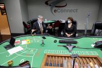 EConnect President and CEO Henry Valentino III, left, gives a tour of his Las Vegas business to ...