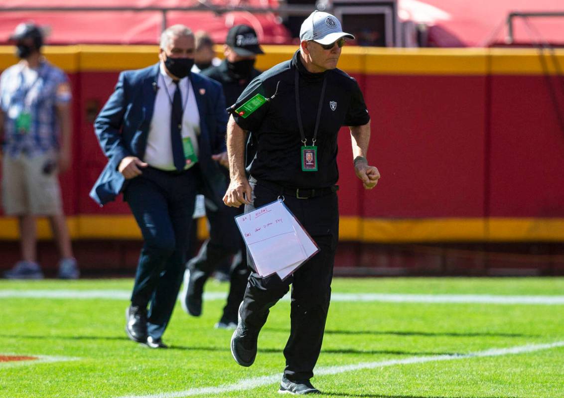 Las Vegas Raiders defensive line coach Rod Marinelli runs on the field before an NFL football g ...