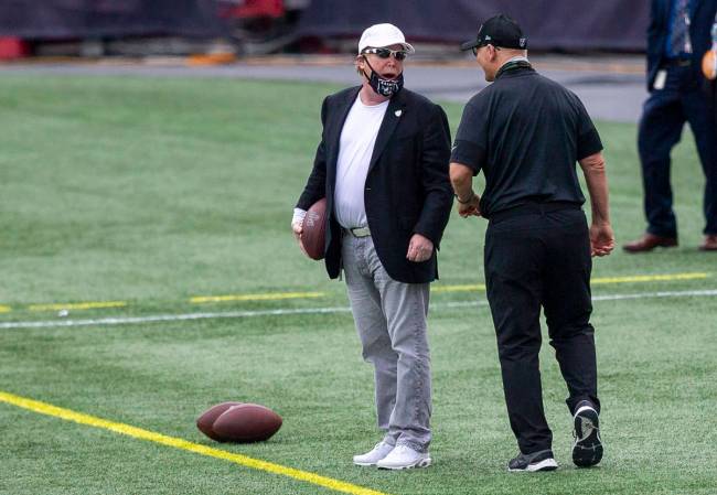 Las Vegas Raiders owner Mark Davis speaks to defensive line coach Rod Marinelli before a game a ...