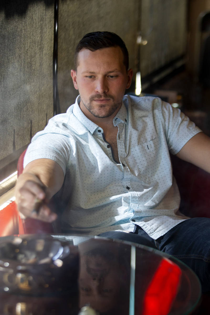 Comedian Rocky Dale Davis smokes a cigar at his regular hangout, En Fuego Cigars & Lounge in La ...