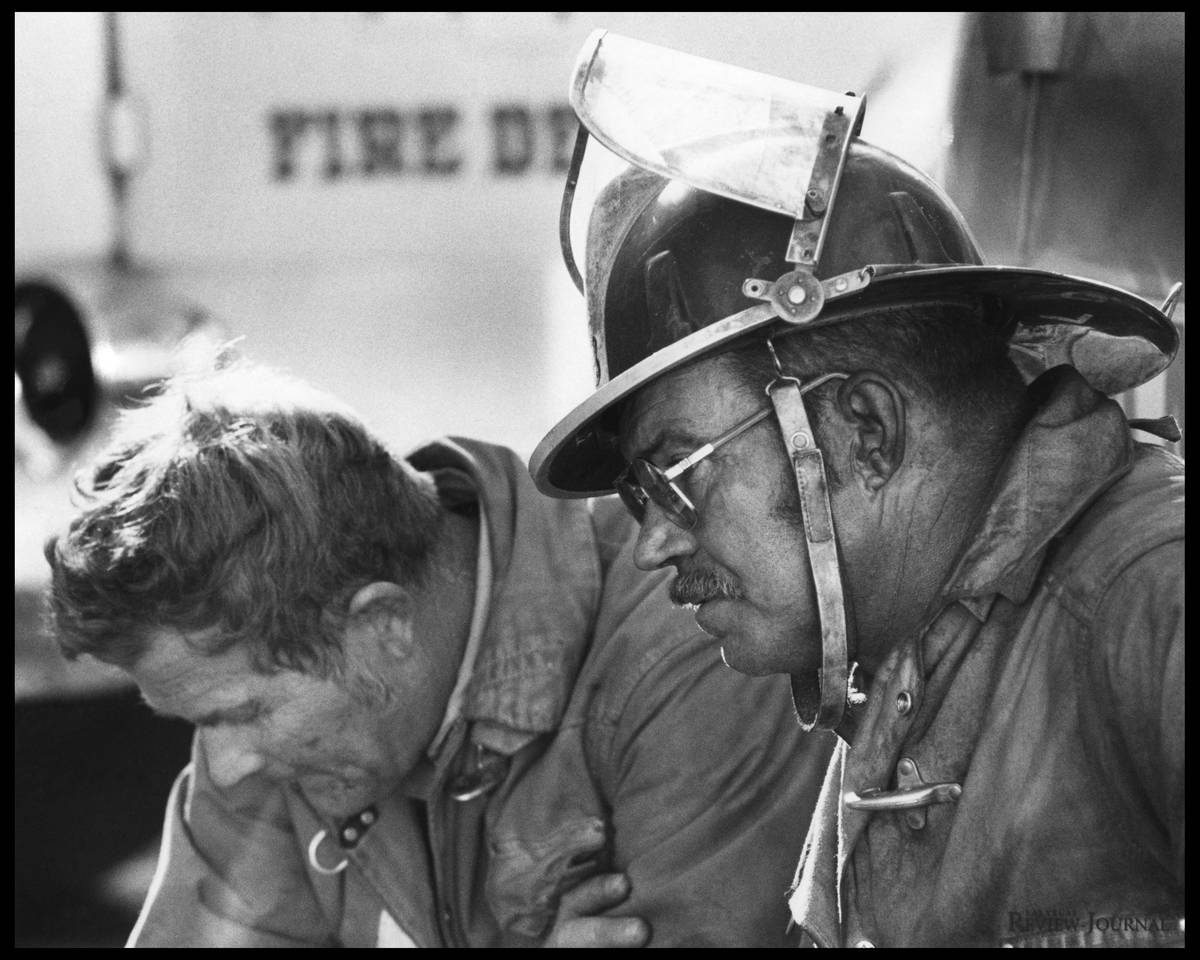 This Nov. 21, 1980, file photo shows Clark County firefighters Andy Anderson and Roy Welch at t ...