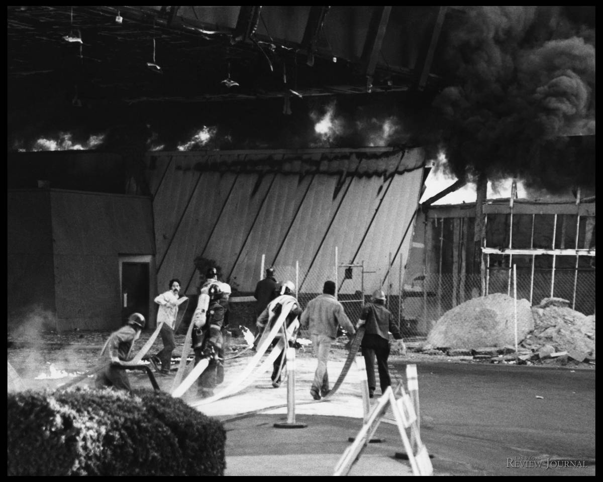 In this Nov. 21, 1980, file photo, construction workers employed at the 760-room addition to th ...