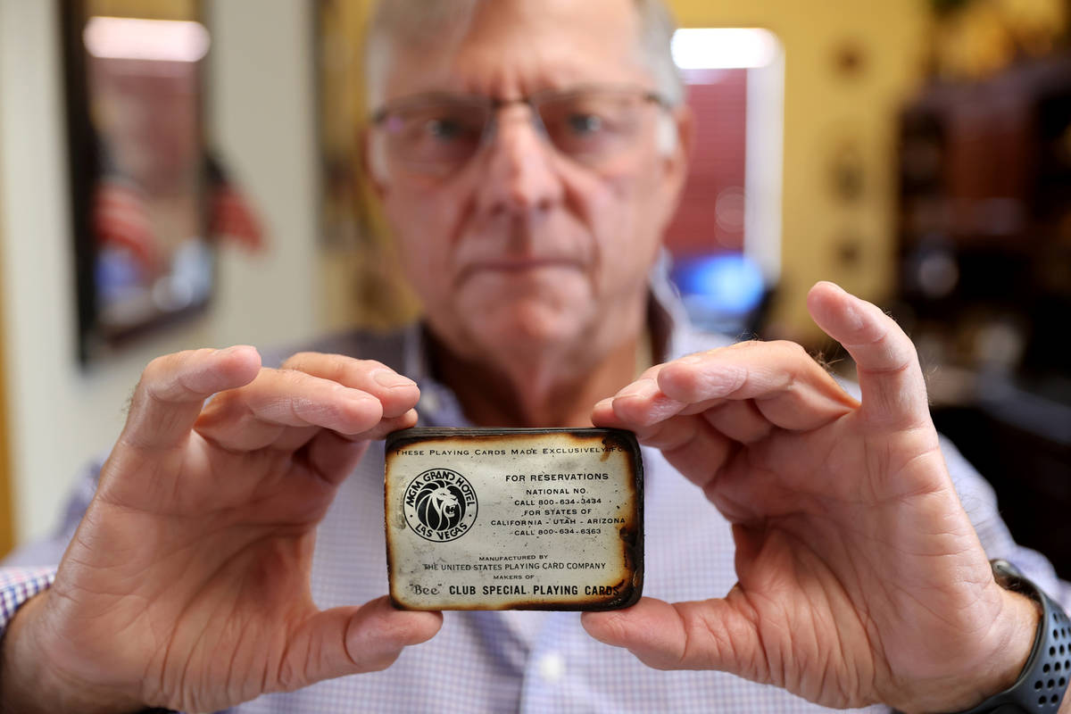 Charlie Lombardo, 72, shows a deck of burned playing cards from the MGM Grand in his Henderson ...
