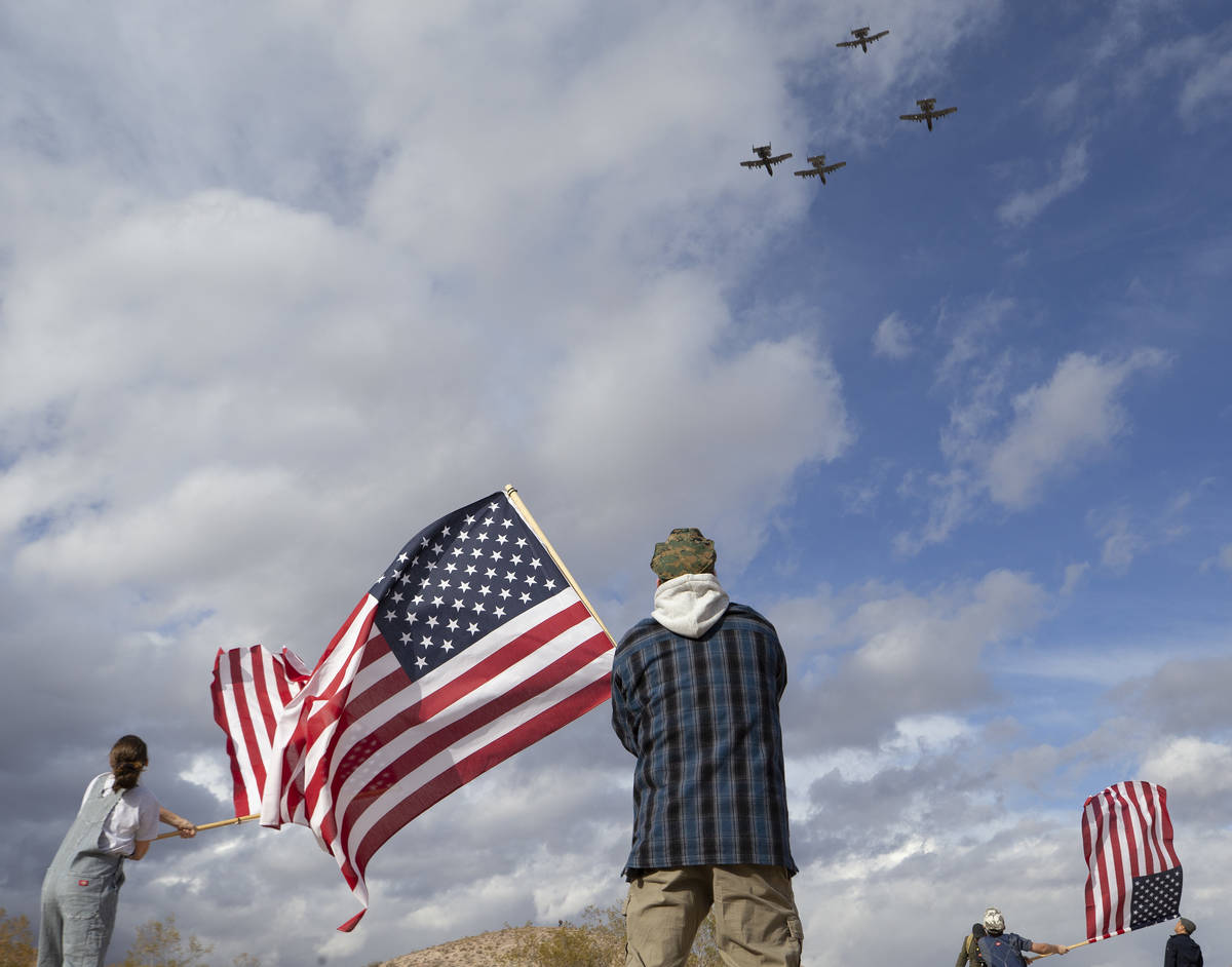 The family of Evan Thompson III, known as "The Real American" to many, wave American ...