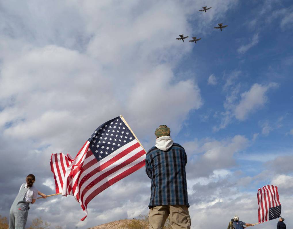 The family of Evan Thompson III, known as "The Real American" to many, wave American ...