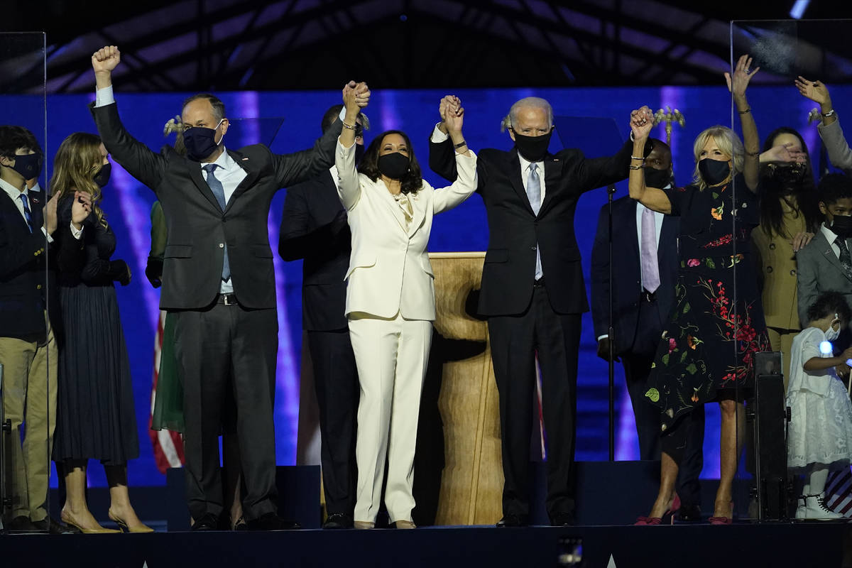 From left, Doug Emhoff, husband of Vice President-elect Kamala Harris, Harris, President-elect ...