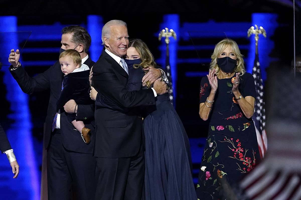 President-elect Joe Biden, with his Jill Biden, right, and members of this family on stage, Sat ...