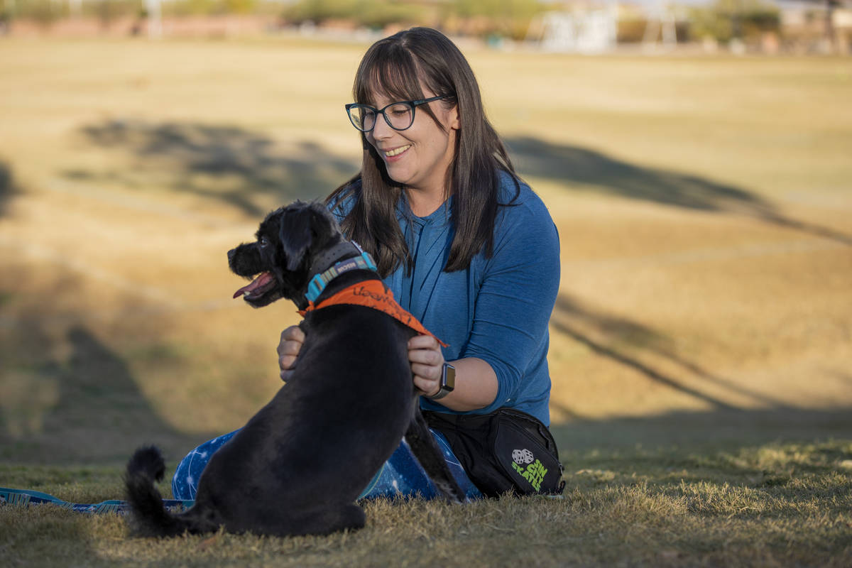 Rachel DiNola, a registered nurse and volunteer, is seen with her dog Izzy, at Mountain's Edge ...