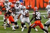 Las Vegas Raiders running back Devontae Booker (23) rushes during the first half of an NFL foot ...
