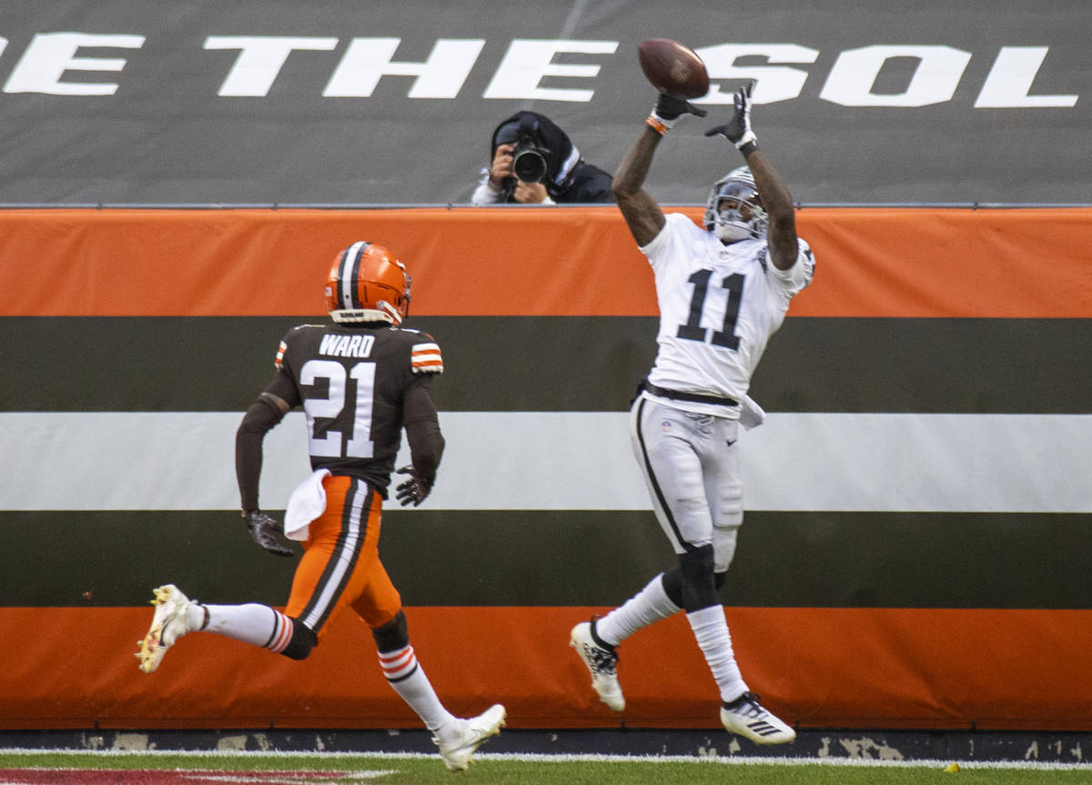 Las Vegas Raiders wide receiver Henry Ruggs III (11) reaches out to try and make a catch agains ...