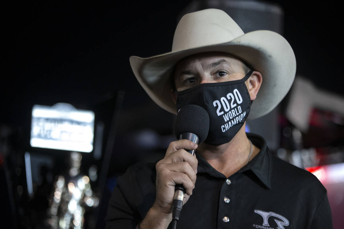 Top Fuel driver Steve Torrence accepts his trophy for the season title of the NHRA Camping Worl ...