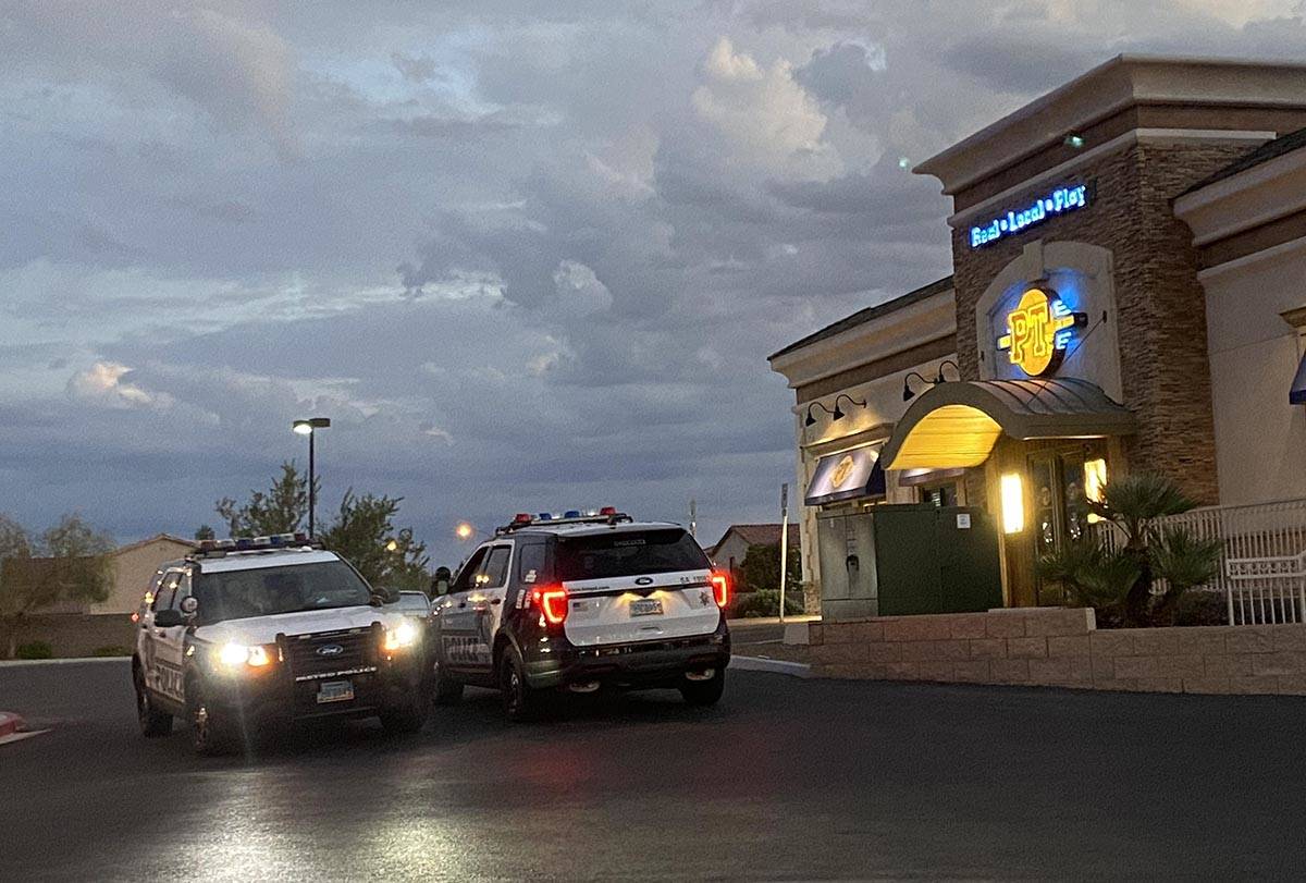 Las Vegas police vehicles at a PTs Gold on the 5600 block of South Hualapai Way in west Las Veg ...