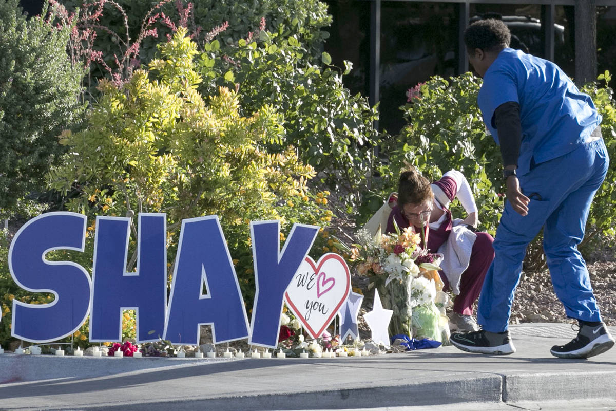 Nurses at University Medical Center (UMC) place flowers outside the hospital during A "Pra ...