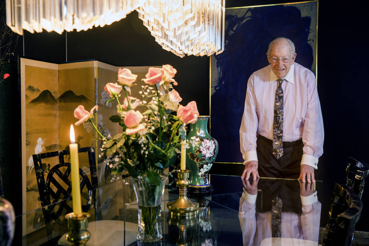 Oscar Goodman stands at the dining room table where he and his wife, Carolyn, hosted a meal for ...