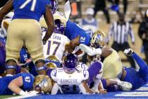 Tulsa running back TK Wilkerson (21) leaps into the end zone for the go-ahead touchdown with un ...