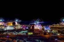 Fireworks for New Year's Eve erupt over the Strip as viewed from the VooDoo Rooftop Nightclub & ...