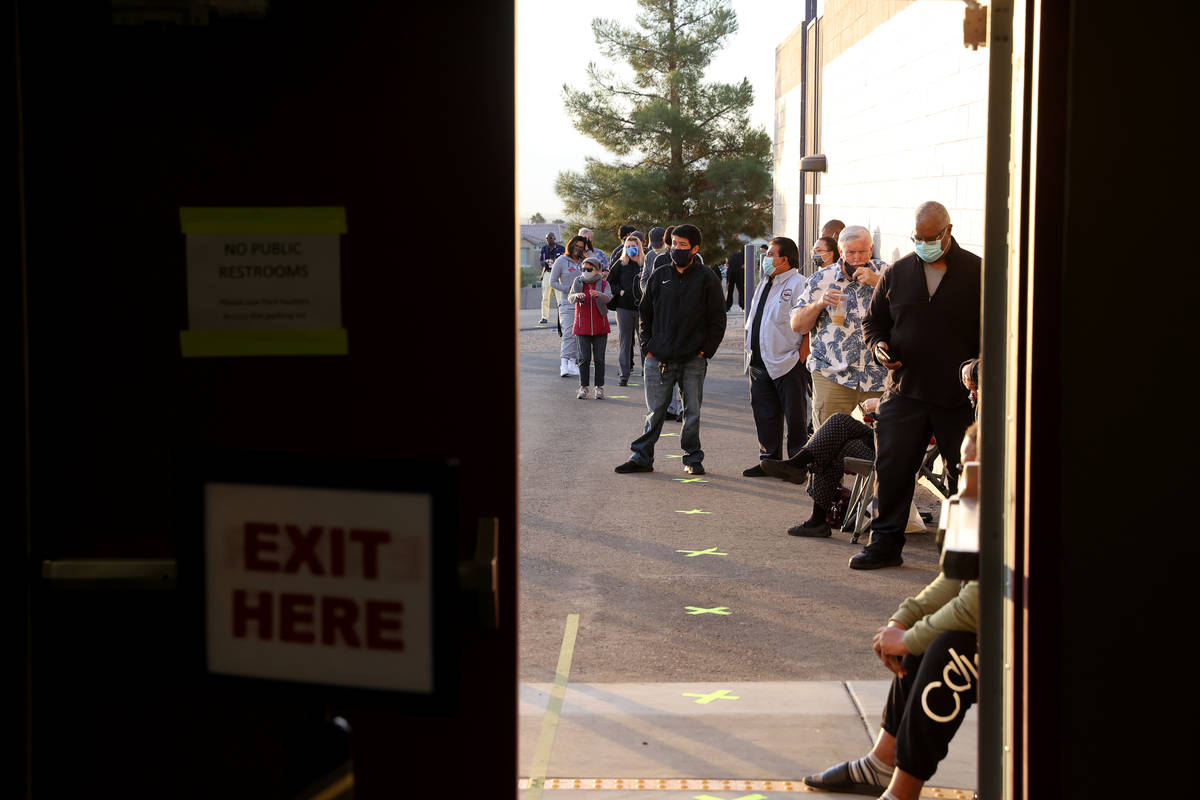 People wait to vote at 6:29 a.m. for the polls to open at 7 a.m. at Desert Breeze Community Cen ...