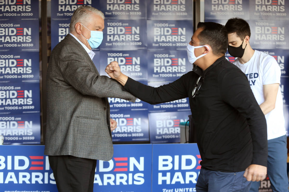 Gov. Steve Sisolak, left, and Assemblyman Edgar Flores, participate during an Election Day kick ...