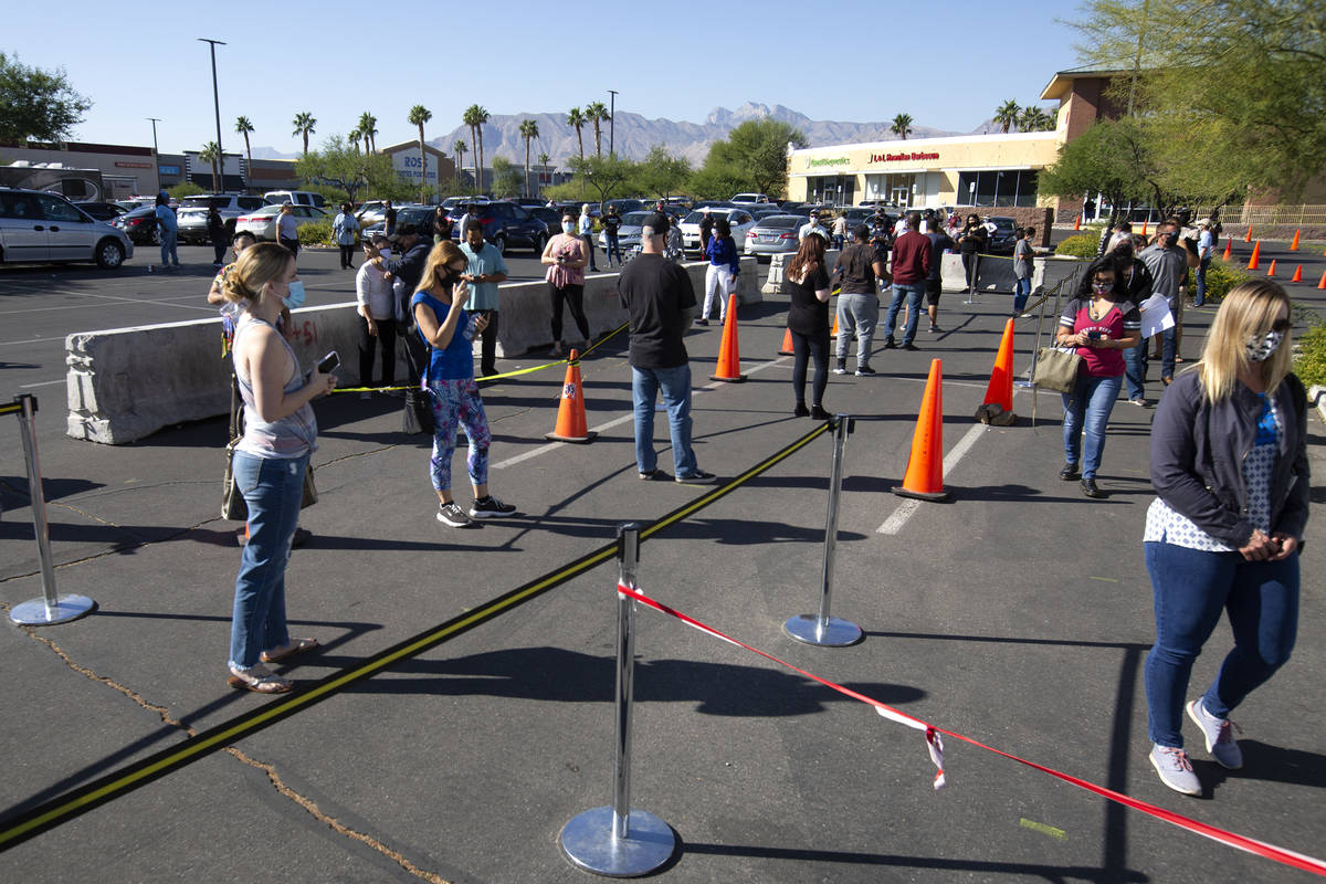 Voters wait in line at the Centennial Center Home Depot voting site on Election Day, Tuesday, N ...