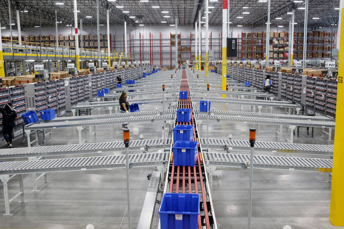 Warehouse workers sort product at a Sephora distribution center, a 714,000-square-foot facility ...
