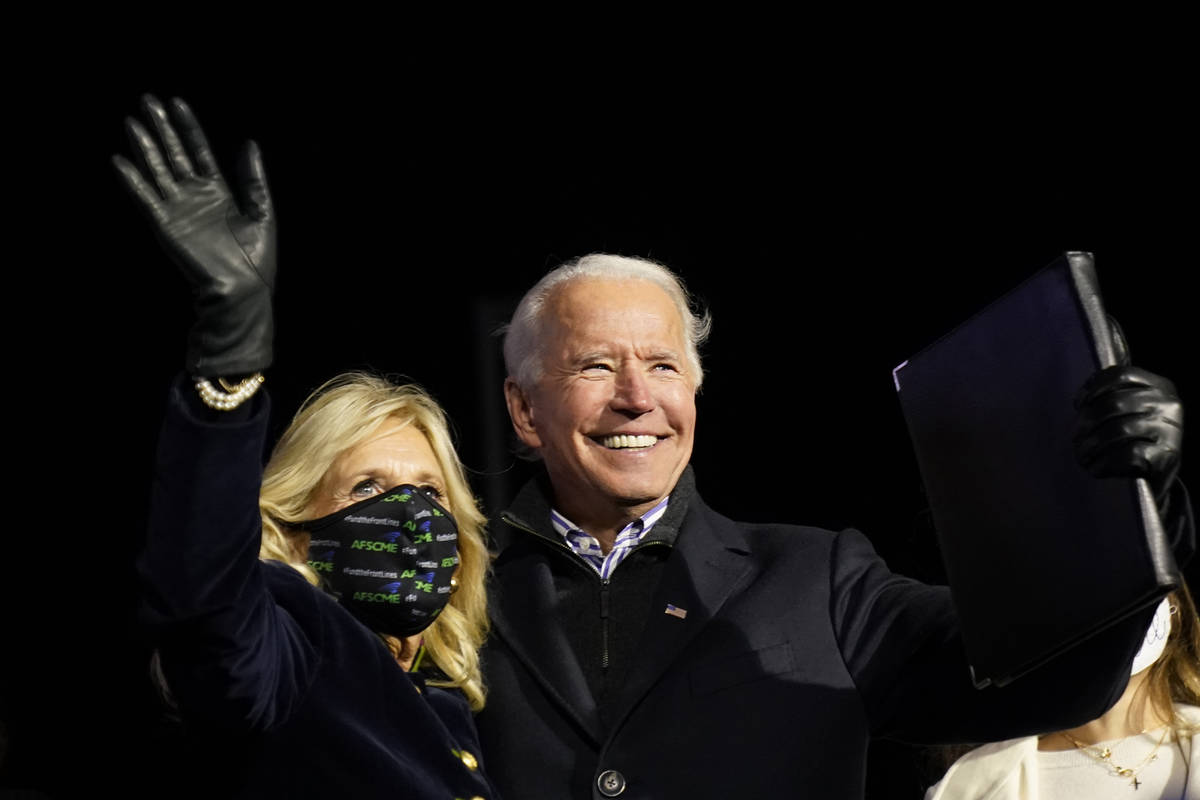 Democratic presidential candidate former Vice President Joe Biden stands with his wife Jill Bid ...