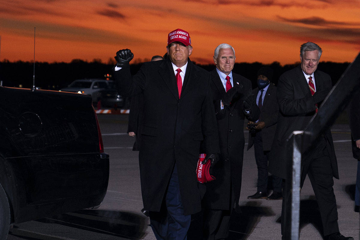 President Donald Trump and Vice President Mike Pence arrive for a campaign rally at Cherry Capi ...