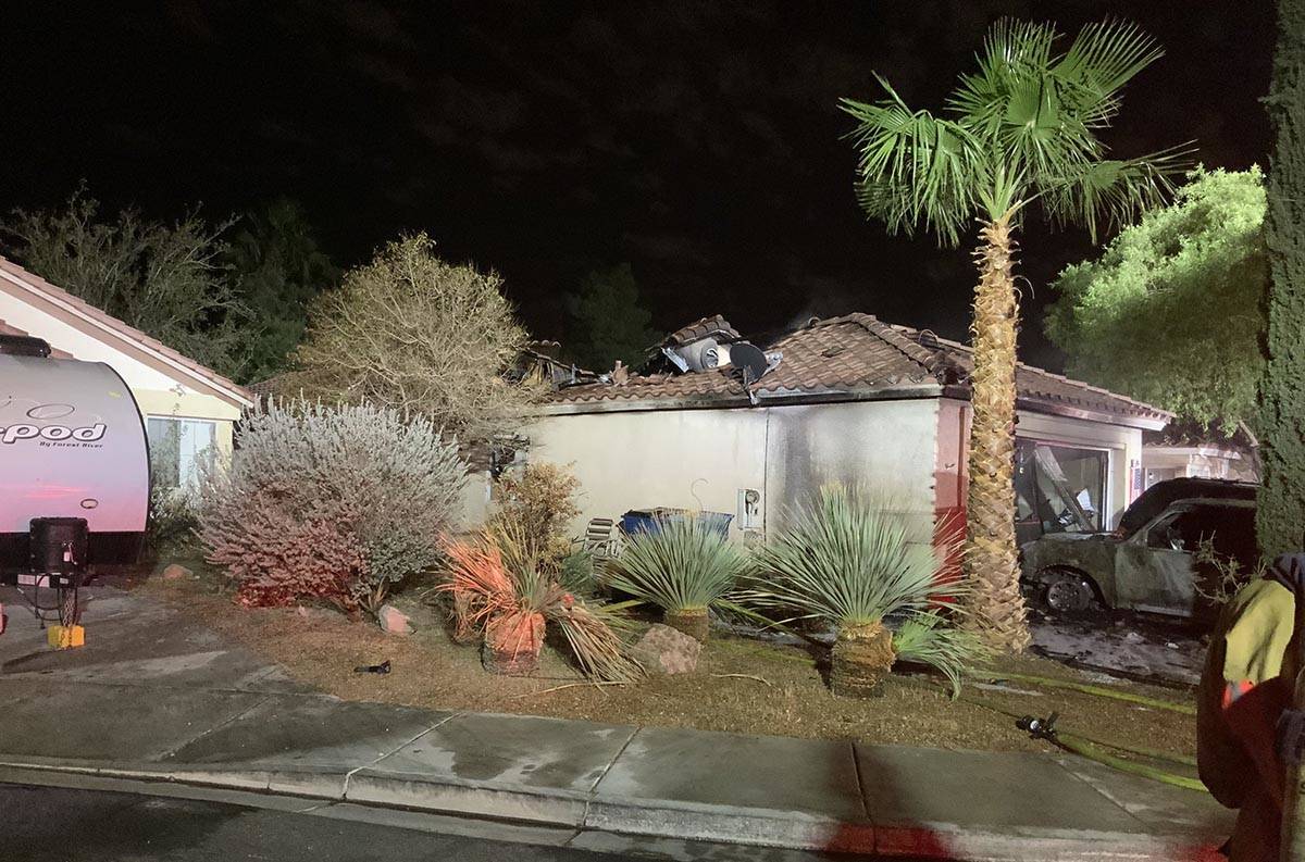 Fire investigators arrested a woman on suspicion of arson about three hours after a 1:20 a.m. f ...