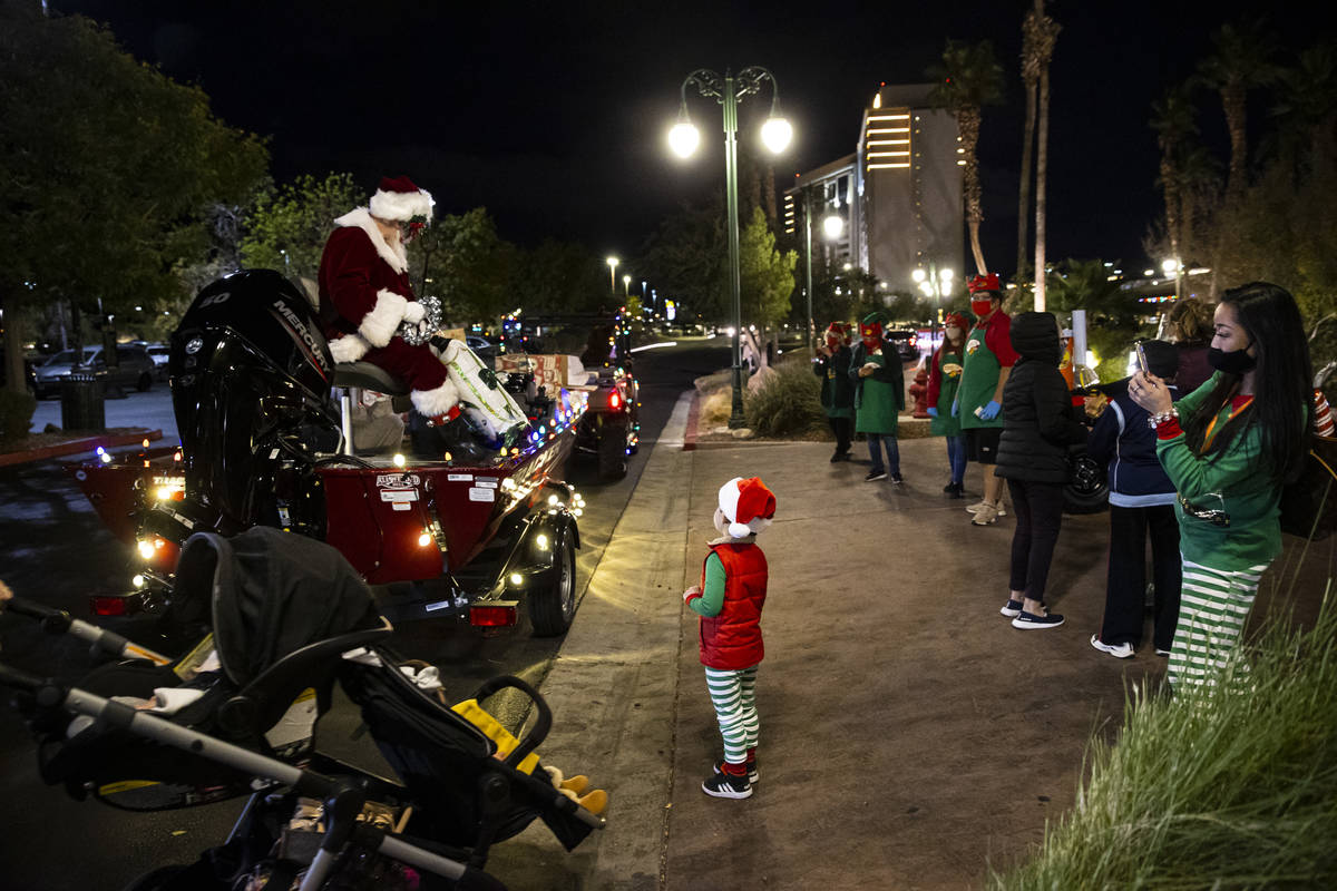 Santa Claus, left, greets Jacob Ault, 5, of Las Vegas, as his mom, Christie Ault, takes a photo ...