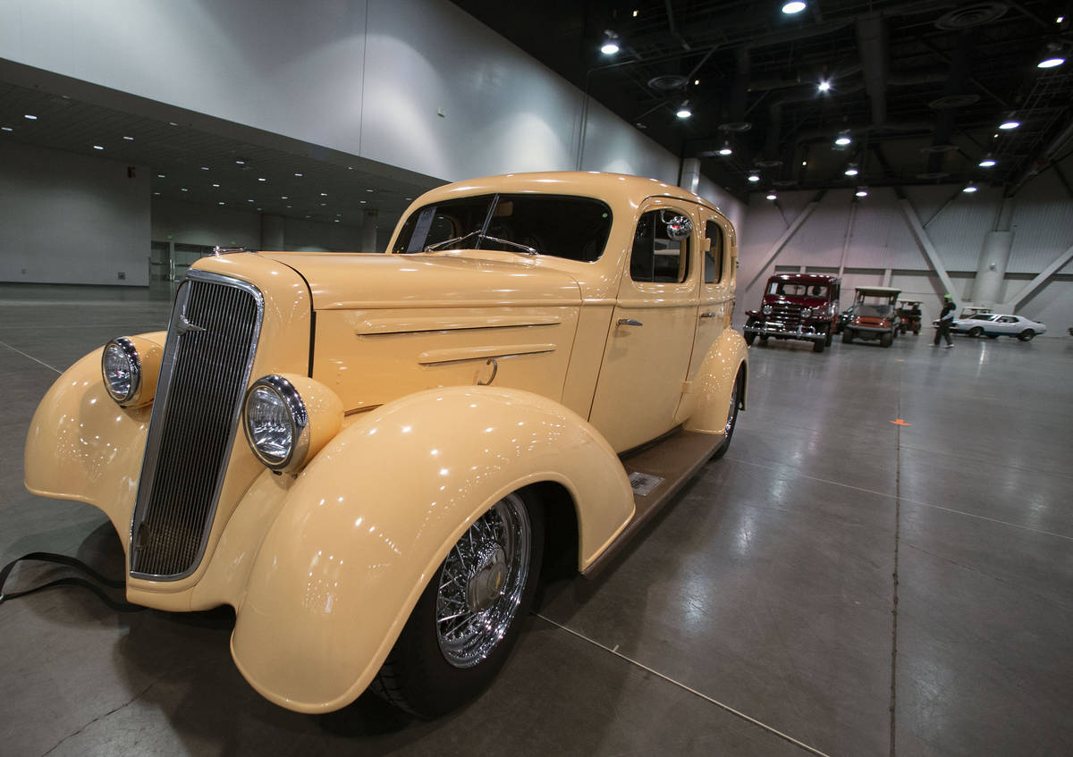 Classic cars, including a 1935 Chevy Master Deluxe Resto Mod, front, are lined up to be auction ...