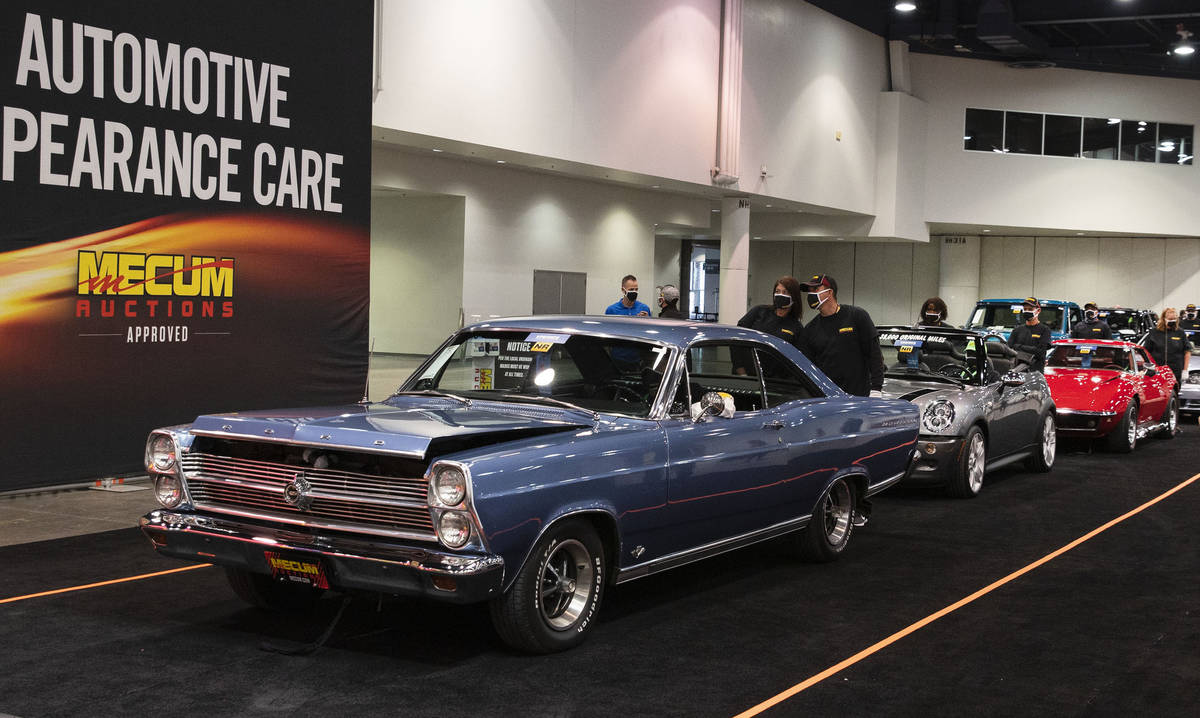 Classic cars, including a 1966 Ford Fairlane 500, front, is displayed to be auctioned at the La ...