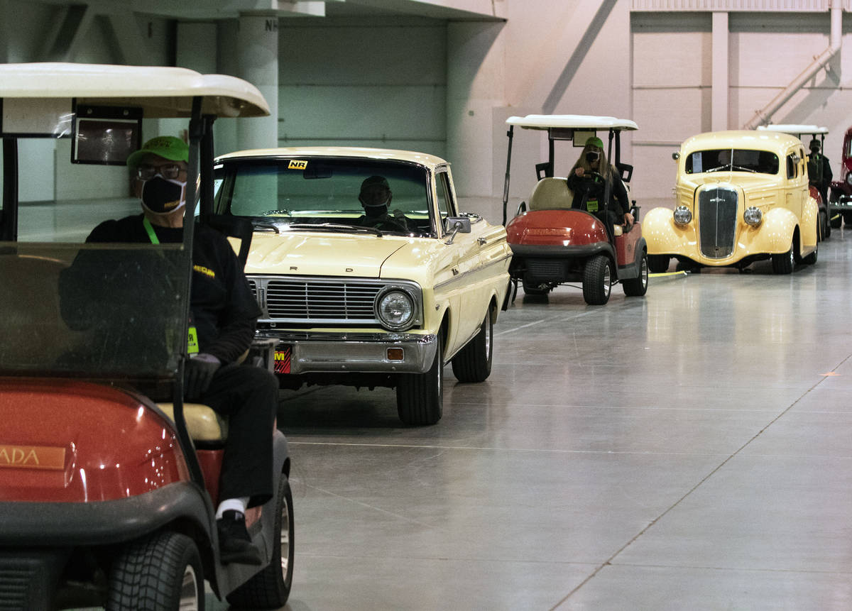 Classic cars are lined up to be auctioned at the Las Vegas Convention Center where Mecum Auctio ...