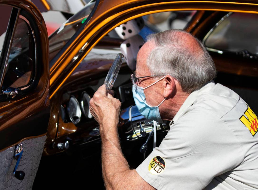 Greg Korcyl, VIN inspector, inspects a 1952 Chevy Business Coupe as cars are lined up to be ins ...