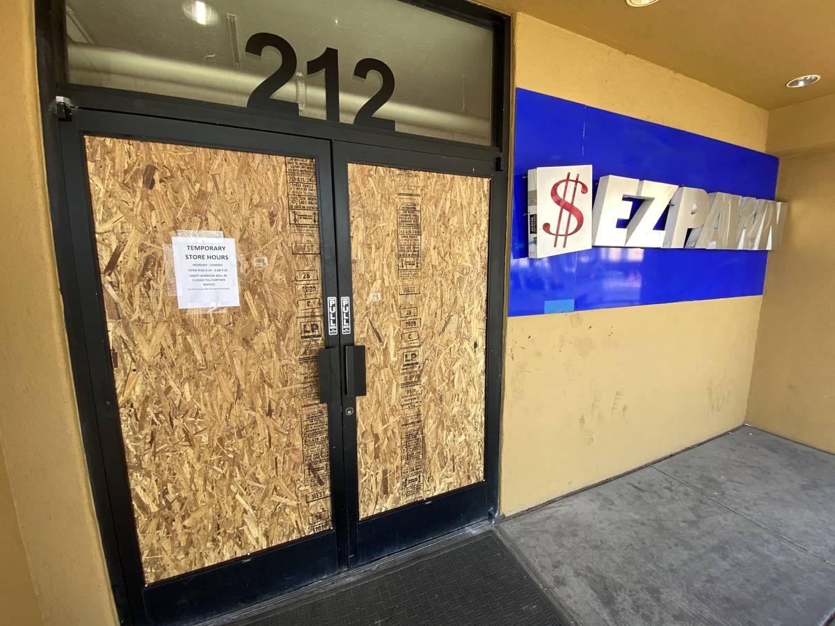 The EZ Pawn on Las Vegas Boulevard that was looted during protests on May 30 is boarded up on E ...