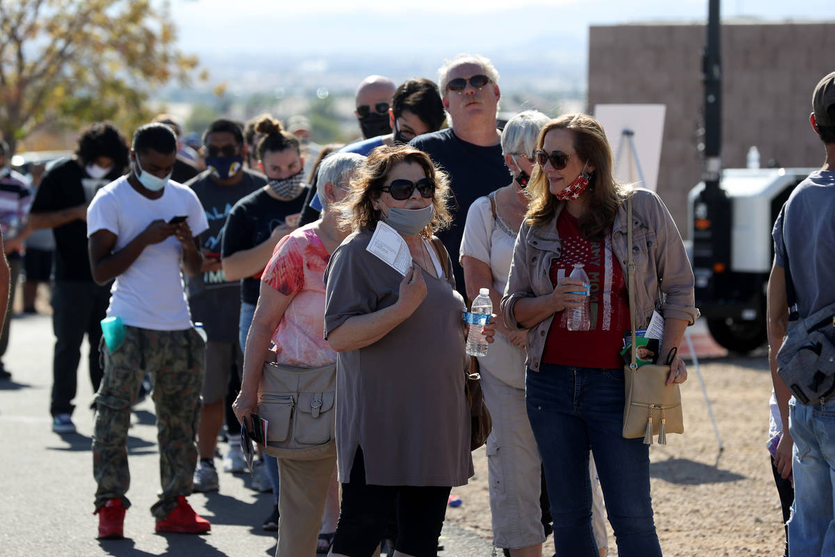 People line up to vote at Desert Breeze Community Center in Las Vegas on Election Day Tuesday, ...