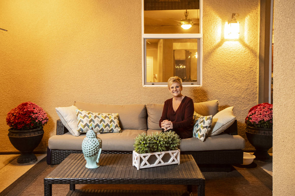 Allyson Johnson, who is in the process of selling her home and buying a new one, poses for a po ...