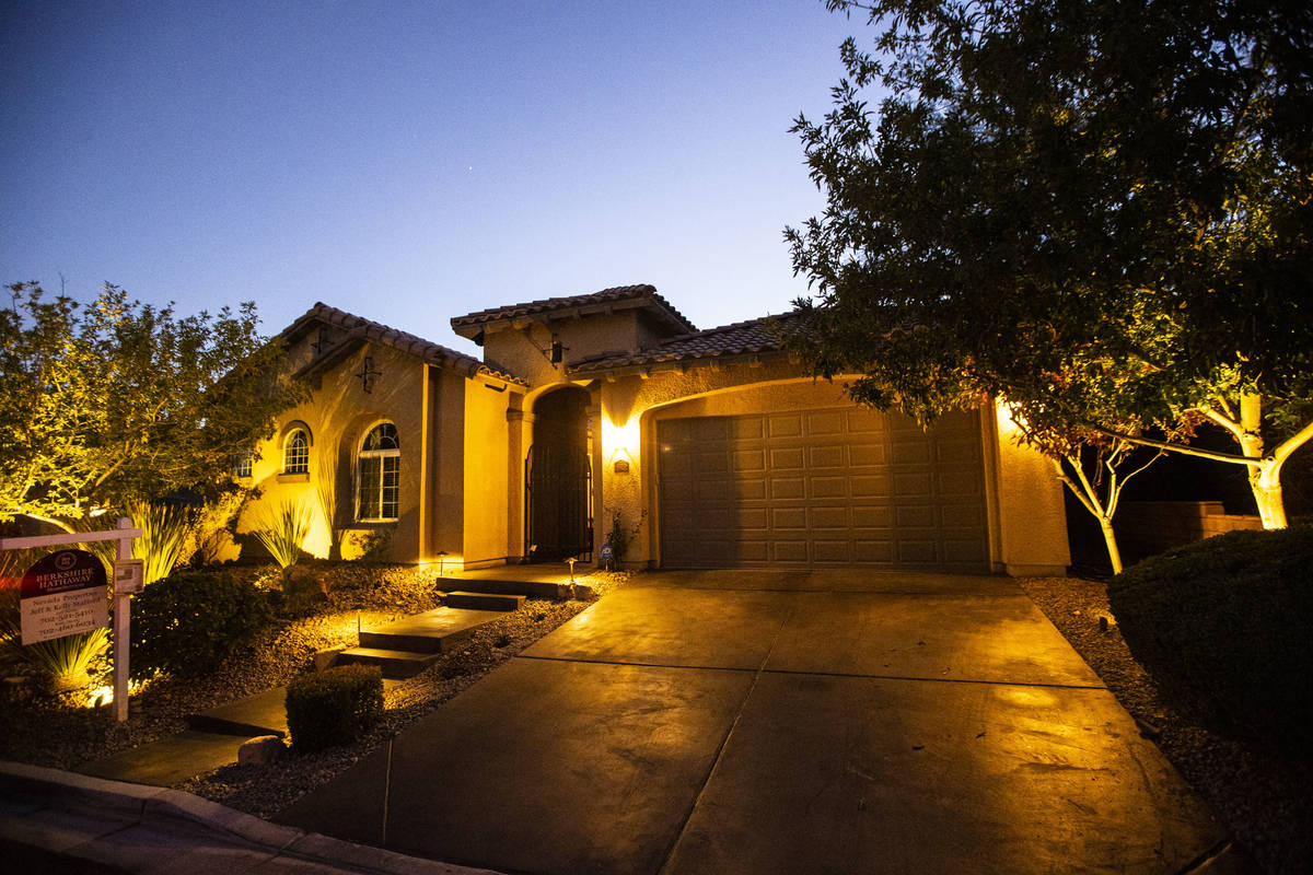 Allyson Johnson, who is in the process of selling her home and buying a new one, poses for a po ...