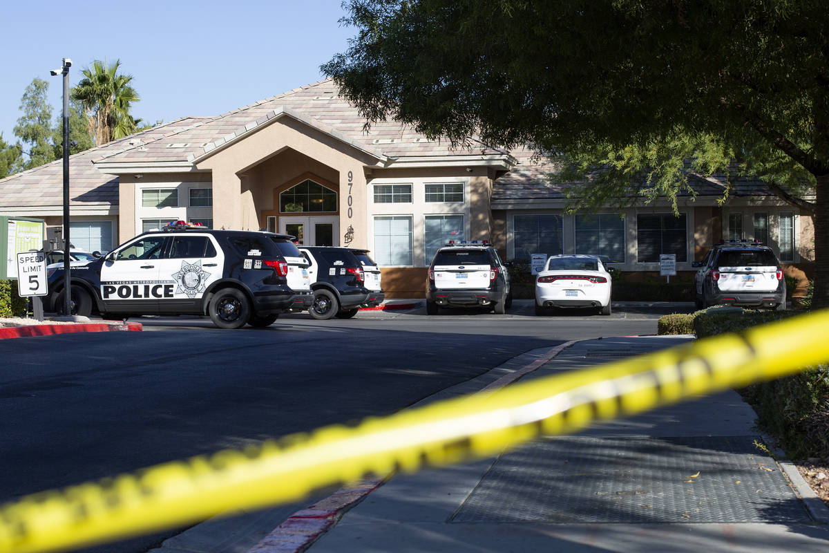 Metropolitan police investigate a homicide at the 9700 block of West Sunset Road near Fort Apac ...