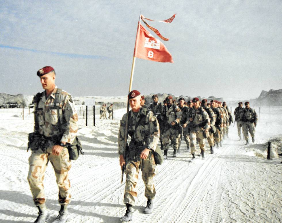 Bravo Company, 27th Engineer Battalion on their way to a holiday ceremony on Christmas Day in 1 ...