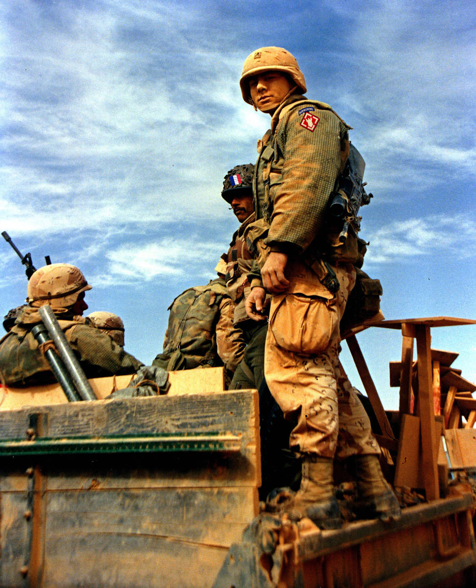 Cpl. Andrew Hodnik stands covered with dust during a pause in a training exchange with the Fren ...