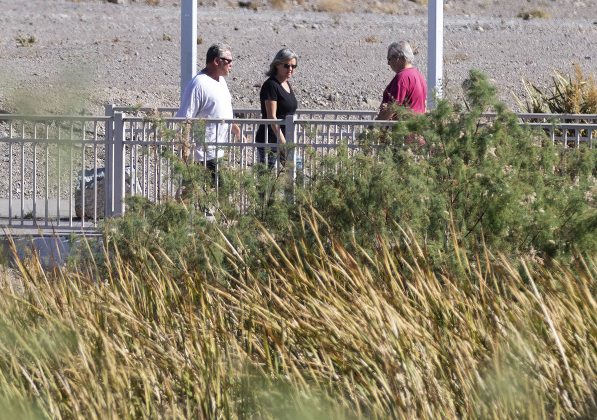 People walk on pedestrian bridge at Cornerstone Park, on Thursday, Nov. 5, 2020, in Henderson. ...