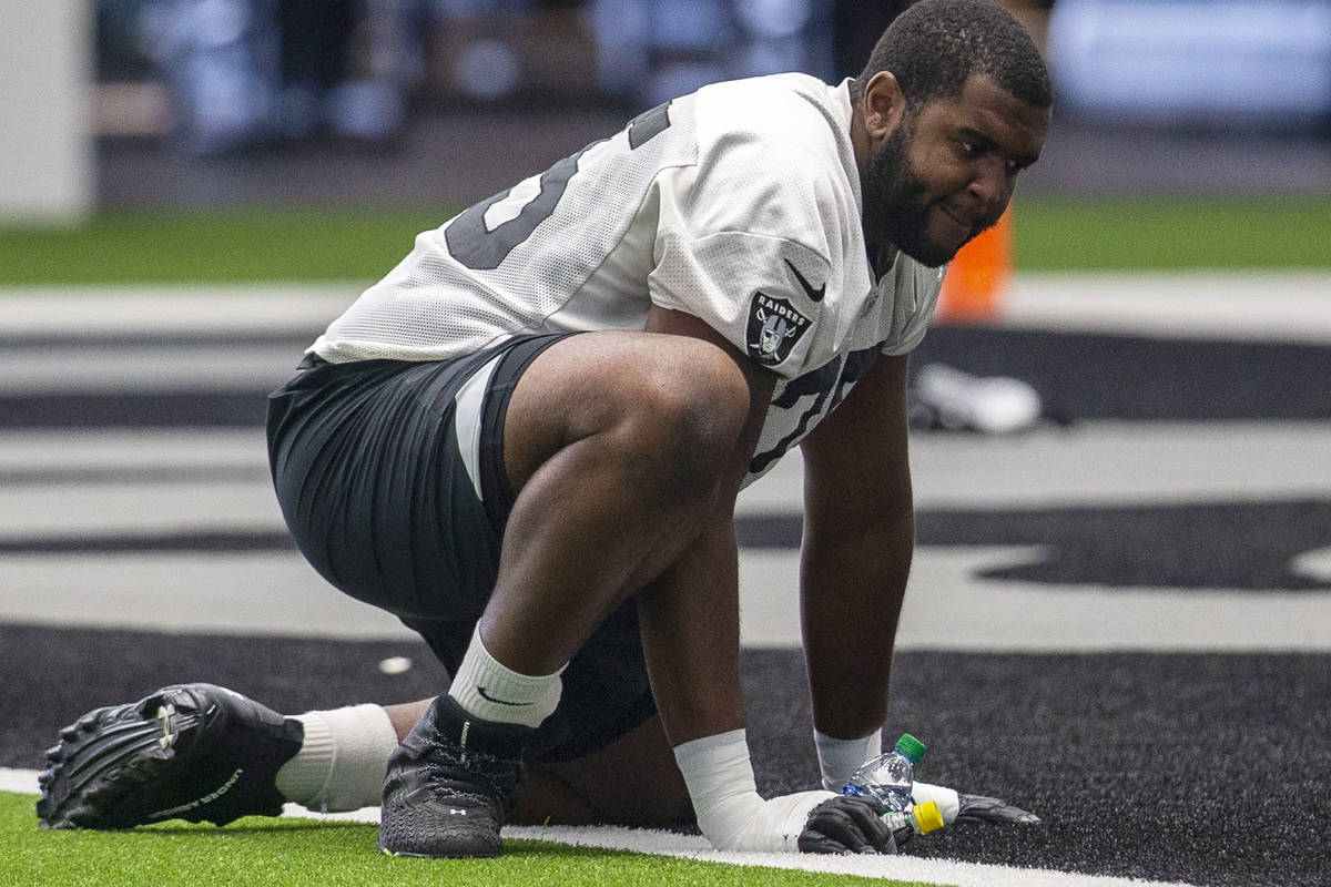 Las Vegas Raiders offensive tackle Brandon Parker (75) stretches during a practice session at t ...