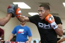 Boxer Devin Haney hits the mitts during a boxing gym workout at Title Boxing gym in Las Vegas, ...