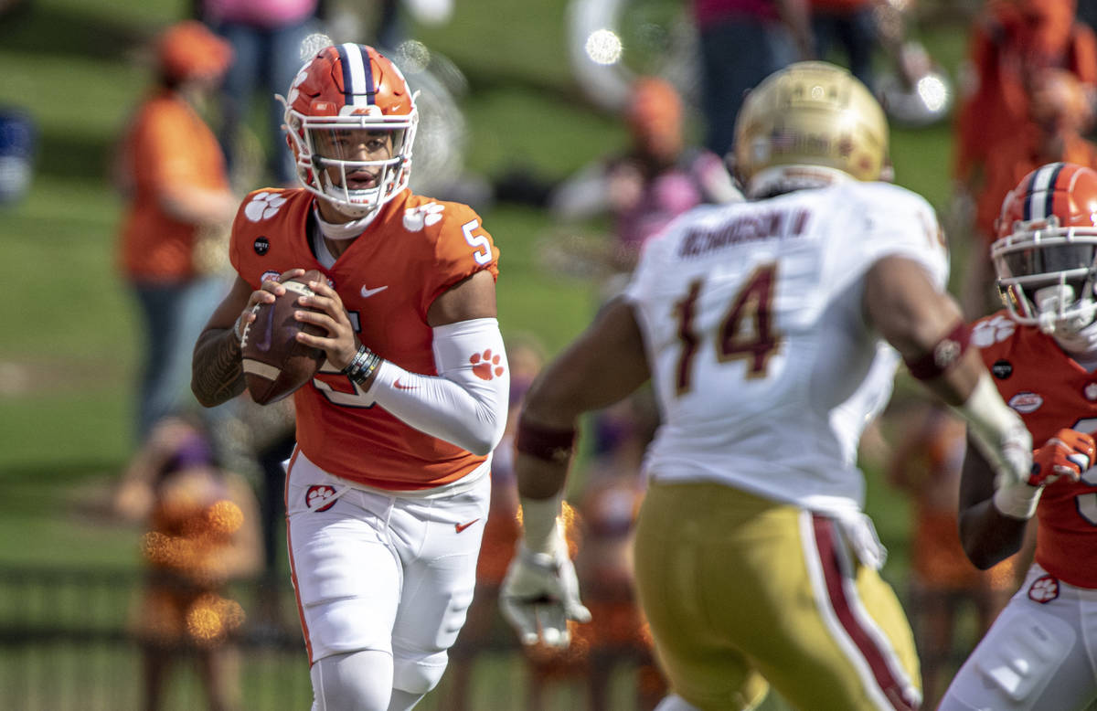 Clemson quarterback D.J. Uiagalelei (5) passes the ball during the first half an NCAA college f ...