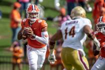 Clemson quarterback D.J. Uiagalelei (5) passes the ball during the first half an NCAA college f ...