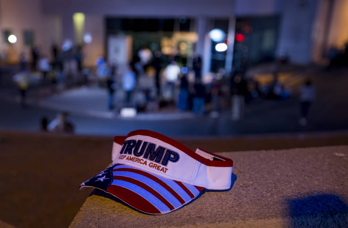 A President Donald Trump hat on the ledge as protests continue outside the Clark County Electio ...